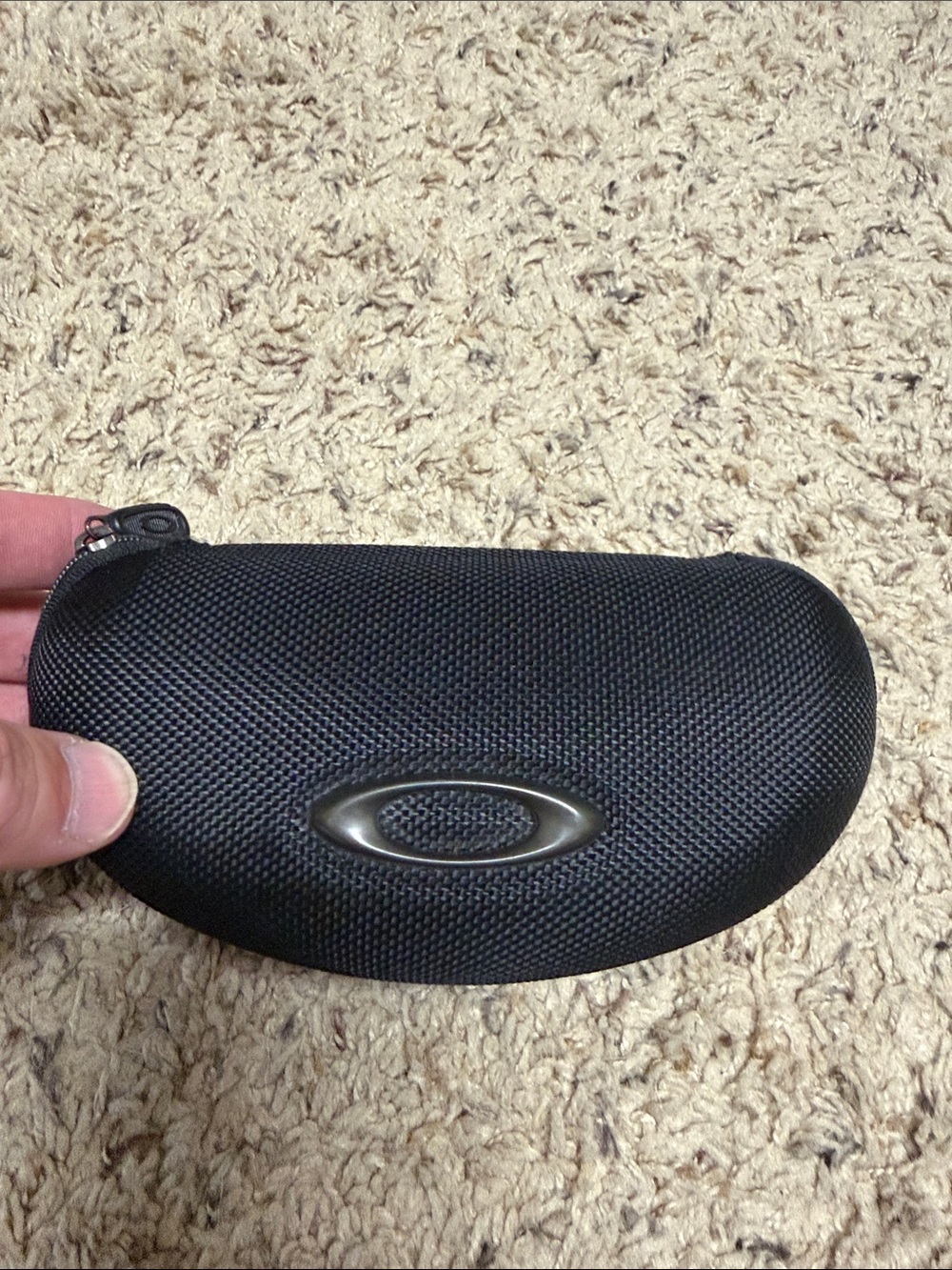 Oakley Black Textured Hard Shell Sunglass Case with Logo fits many styles.